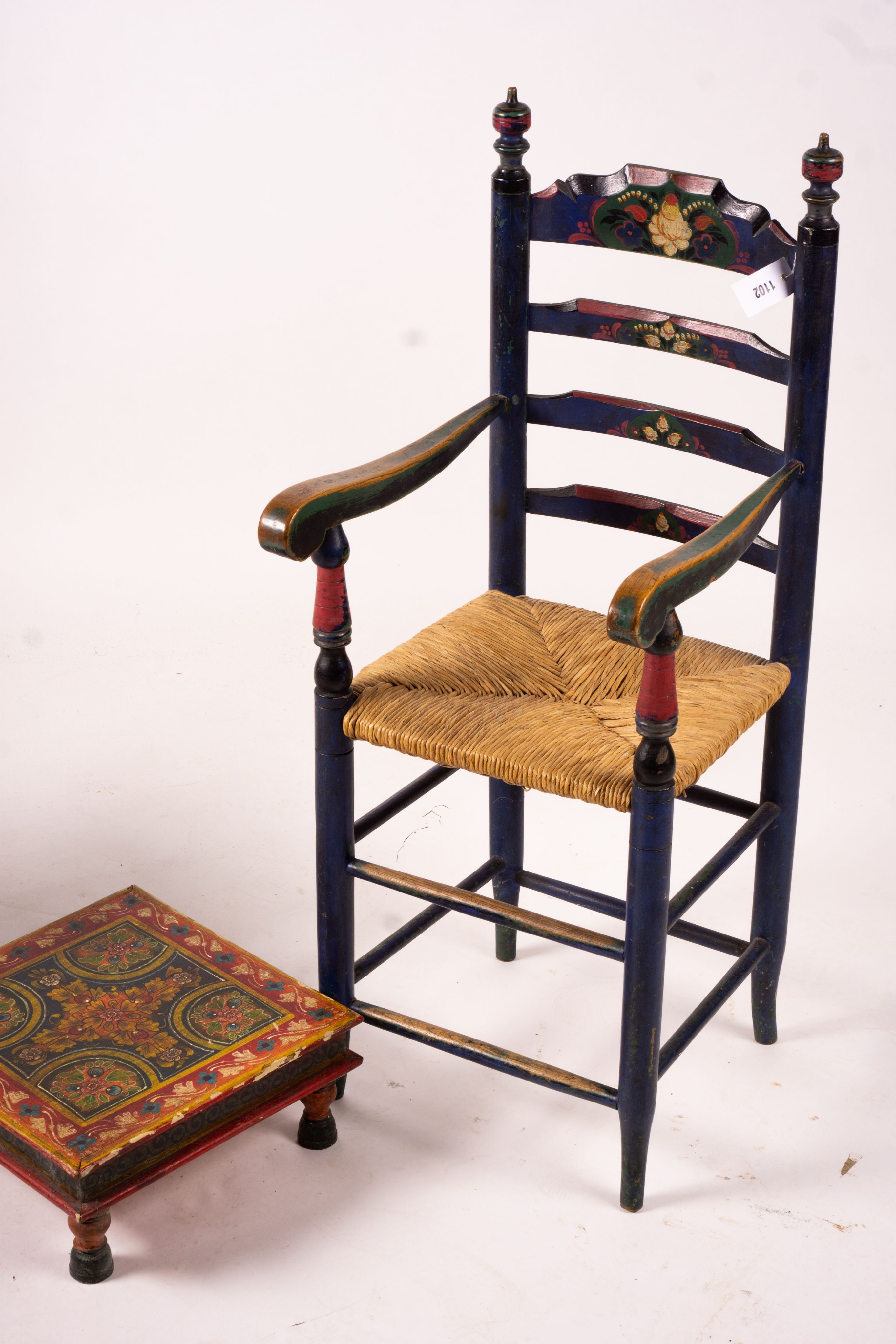 Two 19th / early 20th century Swiss painted rush seat chairs, together with a square low table